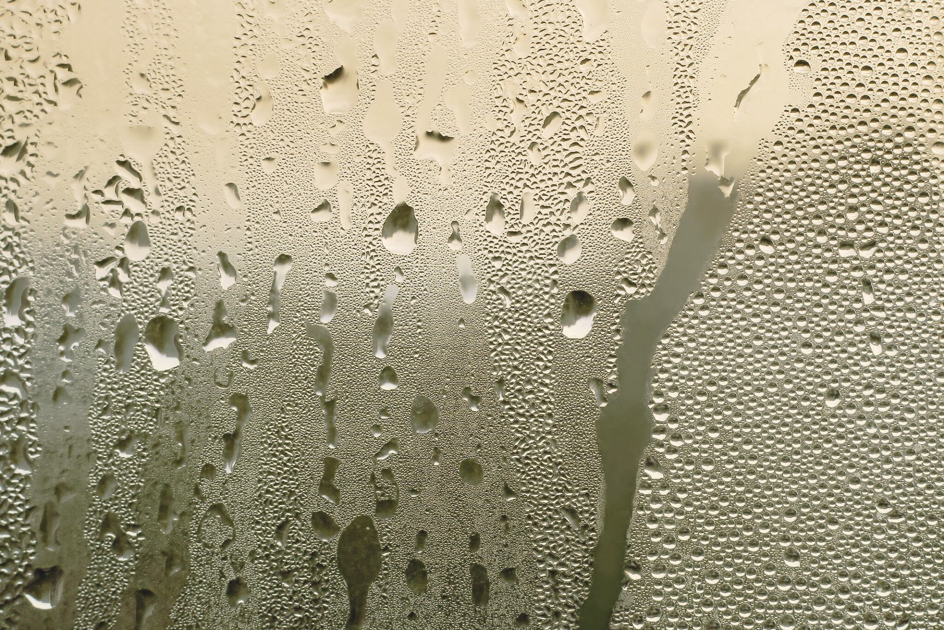 a close up of a window with water droplets on it